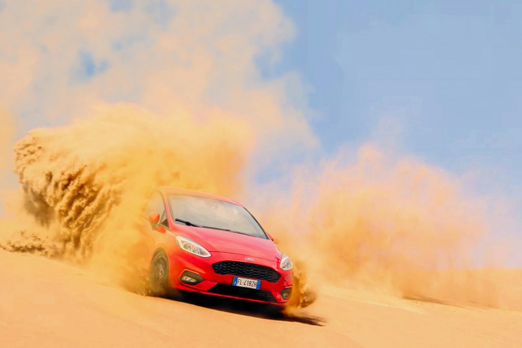 car drifting in sand during endurance challange